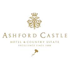 Ashford Castle, a historic luxury hotel in Ireland, surrounded by lush gardens and a lake, showcasing stunning medieval architecture and serene natural beauty