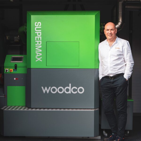 Ger Crosse discussing the benefits of biomass heating systems at a Woodco Renewable Energy event, highlighting the company's role in advancing renewable energy solutions