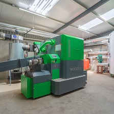 Compact Woodco pellet boiler installed for commercial heating