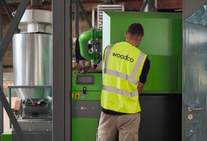 a biomass service engineer servicing a biomass boiler